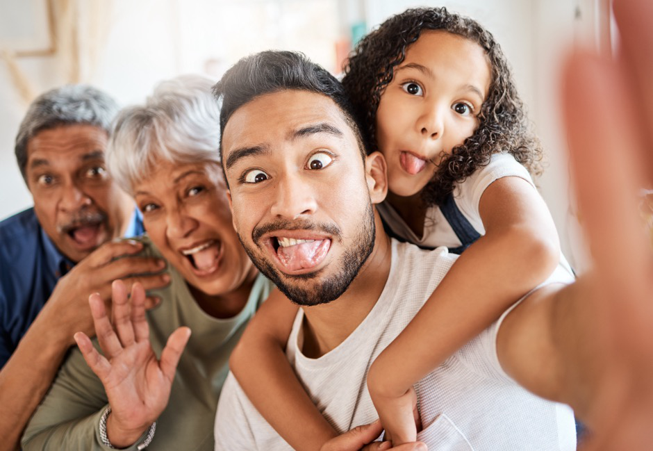 a man, his daughter, and his parents making silly faces